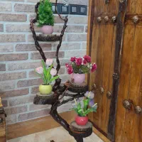 استند گل تنه درختی