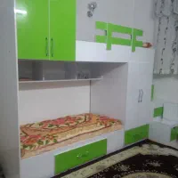 تخت دوطبقه همراه با کمد و کشو