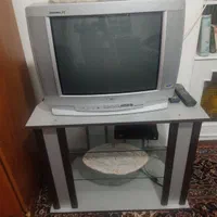 تلویزیون ال جی  و میز ش و دستگاه دیجیتال