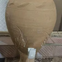 کوزه سفالی شیردار