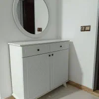 جاکفشی به همراه آینه گرد