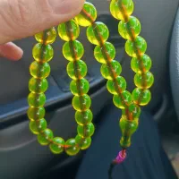 ۲تا تسبیح سندلوس طرح کهنه گری فسفری و نباتی طلایی