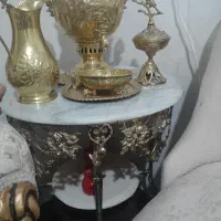 یه عدد میز برنز بزرگ سالم تازه یه سال خریدم