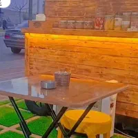 دکه با تابلو برند چای بهار