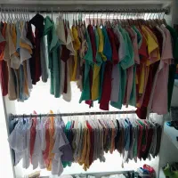 لباس بچه جوراب بارگال مغازه وچوب لباسی بچه