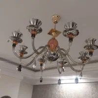 لوستر ۸ شاخه بدنه شیشه ای رنگ نقره ای دودی سالم