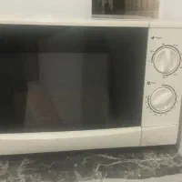 ماکروفر غذا گرم کن و کیک پز