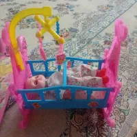 اسکوتر و گهواره عروسک