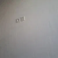 برق کشی ساختمان. برق کار .تعمیر لامپ سوخته