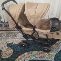 کالسکه دو قلوه نو نو هست. تو عکس معلوم