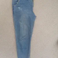 تعدادی لباس مانتو و شلوار و بلوز