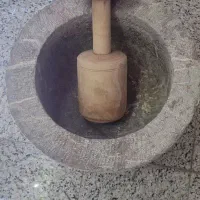 هاون سنگی۱۰۰ساله بادسته چوبی دست ساز قدیمی