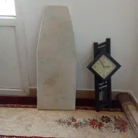 زیر اتو همراه یک عدد ساعت