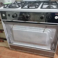 گاز پنج شعله کارکرده فقط شیشه جلوش شکسته
