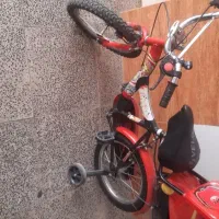 ماشین شارژی و دوچرخه