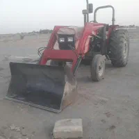 تراکتور بیل لودری با تریلی جهت کار.
