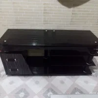 میز شیشه خم ترک کشودار اسکوریت