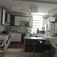 کابینت هایگلاس سفیدوطوسی همراه اجاق گازه استیل