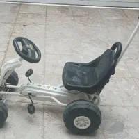 ماشین چهار چرخ دسته دار