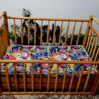 تخت کودک نرده ای چوب طبیعی