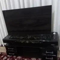 تلوزیون همراه با میز کاملا سالم