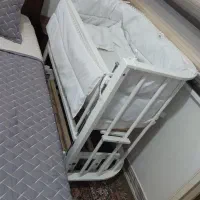 گهواره کنار مادر