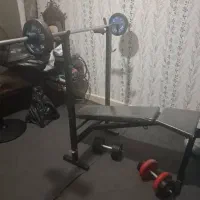 تخته پرس ، به همراه هالتر و دمبل