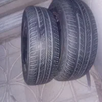 یه جفت لاستیک 70درصد  پژویی185/۱۴  با رینگش