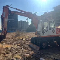 بیل مکانیکی لاستیکی اطلس