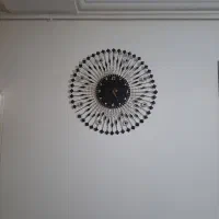 ساعت دیواری طرح خورشیدی در حد نو