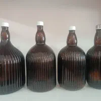 بطری شیشه ای قهوه ای وسفید