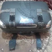 ساعت و چمدان