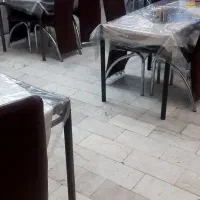 دوعدد درب و مقداری میز و صندلی رستورانی