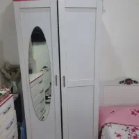 سرویس خواب دخترانه شامل کمد و کتابخانه و میز آرایش