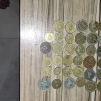 فروش 62 سکه ایرانی و خارجی قدیمی