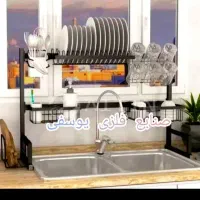 آبچکان جاظرف پشت پنجره