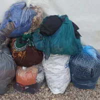 چند تا پلاستیک لباس استفاده شده همه با هم ۳۰۰