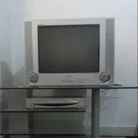 تلویزیون ۲۱ اینچ و میز شیشه mdf