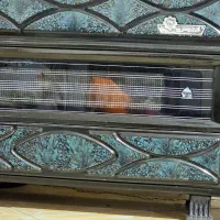 بخاری و میز تلویزیون