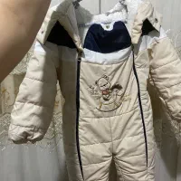 آغوش مادر و لباس بچه از سه ماه تا یکسال