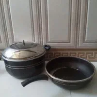تعدادی قابلمه و وسایل آشپزخانه