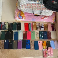 تعدادی بک کاور و سیم و آداپتور آدابتور شارژر کلگی