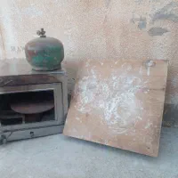 یک عدد تنور گازی استیل با میز وردنه و یک پیک نیک