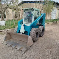خاک برداری. توماس مینی لودر بابکت مصالح ساختمانی
