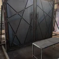 در فلزی پارکینگی دولنگه لولایی جکی