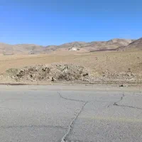 زمین بر جاده اصلی