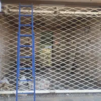 تعویض فنر وتعمیر درب کرکره ای قدیمی