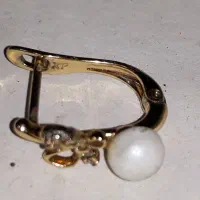 یک عدد گوشواره روکش طلا
