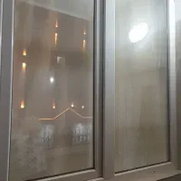 یک پنجره و یک درب بالکن دوجداره یو پی وی سی درحدنو