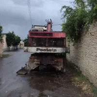 بیل میکانیکی  چرخ لاستیکی پوکلن 80